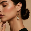 Zirkon taş detaylı modern gold kadın kupe